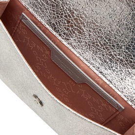 Stella McCartney silver crossbody bag interior, showing brown polyester lining with embossed logo pattern and inner slip pocket