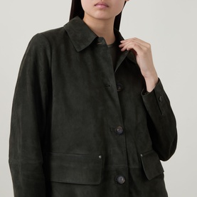 Model wearing Vince olive calf suede jacket with button front, patch pockets and spread collar, close-up detail view
