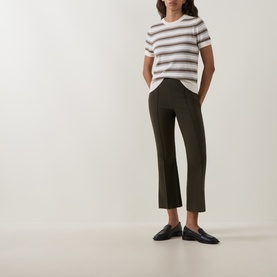 Model wearing Vince Artichoke Combo striped cotton-cashmere T-shirt, styled with dark olive cropped trousers and black loafers.