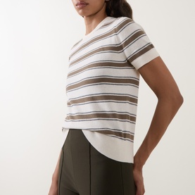 Model wearing Vince T-Shirt in Artichoke Combo, ivory and brown horizontal stripes, short sleeves, styled with an olive skirt.