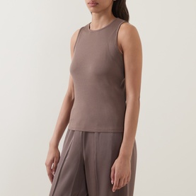 Model wearing Vince brown cashmere-silk sleeveless top with crew neck, styled with matching wide-leg trousers.