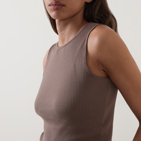 Model wearing Vince brown ribbed cashmere-silk sleeveless tank top, close-up detail of neckline and fitted silhouette.