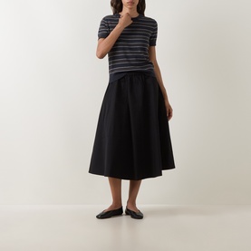 Model wearing Vince Thyme Combo striped cotton-cashmere T-shirt, styled with black midi skirt and black ballet flats.