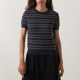 Model wearing Vince T-Shirt in Thyme Combo, navy striped cotton cashmere knit with short sleeves and crew neck, styled with black midi skirt.