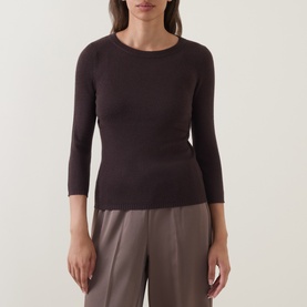 Model wearing Vince top in Taupe Haze, fitted 3/4 sleeve crew neck style, paired with taupe wide-leg trousers.