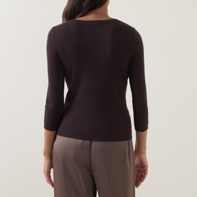 Model wearing Vince top in Taupe Haze, shown from behind, featuring a boat neckline and three-quarter sleeves in fitted cotton knit.