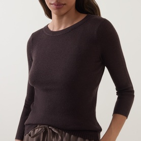 Model wearing Vince top in Taupe Haze, ribbed crew neck with three-quarter sleeves, paired with satin trousers