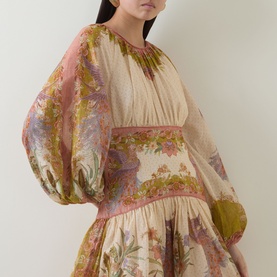 Model wearing Zimmermann dress in Chartreuse Scarf Floral, featuring voluminous balloon sleeves and layered floral print fabric.