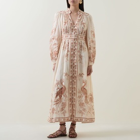 Model wearing Zimmermann Indra Linen Plunge Dress in Cream Tan Floral, with billowed sleeves and floral bird print, styled with brown strappy sandals.