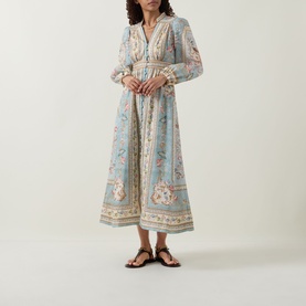 Model wearing Zimmermann Roselight Tapestry Floral Dress in Blue Tapestry Floral, midi length with long billowy sleeves, V-neckline and flared skirt