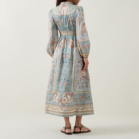 Model wearing Zimmermann Roselight Tapestry Floral Dress in Blue Tapestry Floral, back view, long billowy sleeves, flared midi skirt, paired with