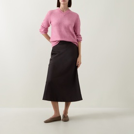 Model wearing InWear Chocolate Brown midi skirt with pink knit jumper and flat loafers.