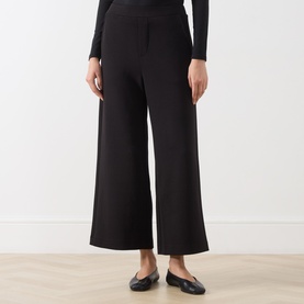 Model wearing InWear black wide-leg trousers in modal blend, styled with a black long-sleeve top and black ballet flats.