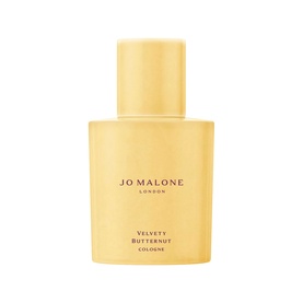 Jo Malone London Velvety Butternut Cologne in a golden-yellow rectangular bottle with black text branding