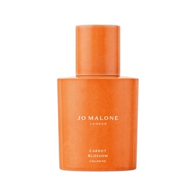 Jo Malone London Carrot Blossom Cologne in textured orange bottle with curved silhouette and branded label