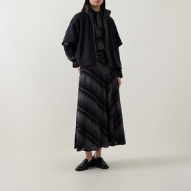 Model wearing Luisa Cerano anthracite knitwear styled with dark check midi skirt, navy cropped jacket and black leather mules
