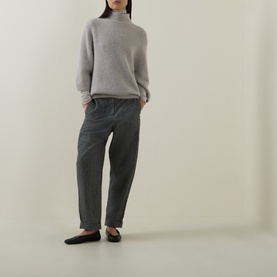 Model wearing Luisa Cerano pearl alpaca-blend turtleneck jumper, styled with dark grey tapered trousers and black flat shoes.
