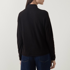 Model wearing Luisa Cerano truffle wool-cashmere knit top, rear view, styled with dark blue jeans