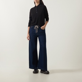Model wearing Luisa Cerano truffle wool-cashmere polo knit with wide-leg dark indigo jeans and black chunky loafers.