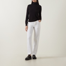 Model wearing Luisa Cerano Solid Turtleneck Sweater in Truffle, fine knit, long sleeves, styled with white straight-leg jeans and black loafers.