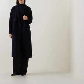 Model wearing Luisa Cerano Winter Navy wool-blend knitwear, styled with a matching navy longline coat and wide-leg trousers.
