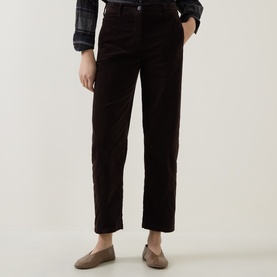 Model wearing Luisa Cerano Velvet Barrel Leg Cropped Trousers in Truffle, styled with a plaid shirt and taupe loafers