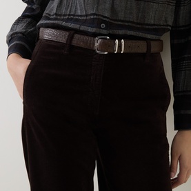 Model wearing Luisa Cerano Velvet Barrel Leg Cropped Trousers in Truffle, styled with a brown croc-embossed belt and checked shirt.