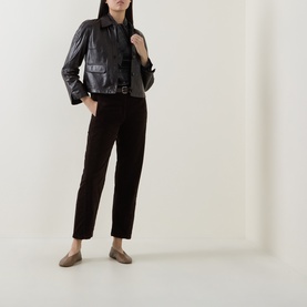 Model wearing Luisa Cerano Velvet Barrel Leg Cropped Trousers in Truffle, styled with a black leather jacket and taupe ballet flats