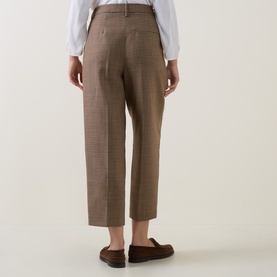 Model wearing Luisa Cerano multi check tailored trousers, rear view, styled with a white shirt and brown loafers