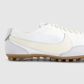 Nike Moon Shoe Trainers in Summit White and Soft Pearl with cream Swoosh, leather accents, and tan gum Waffle outsole