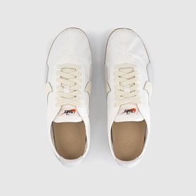 Nike Moon Shoe Trainers in Summit White Soft Pearl, overhead view showing nylon upper, leather accents, orange Swoosh branding and lace-up fastening