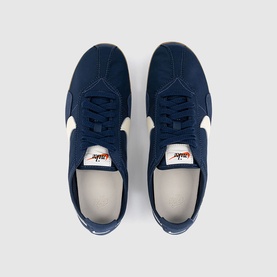 Nike Dump trainers in Midnight Navy and Soft Pearl, overhead flat lay showing navy suede upper with cream toe and heel detail