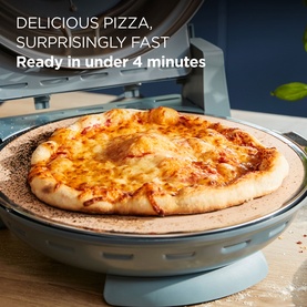 Kenwood My Pizzeria Pizza Oven in Storm Blue with golden melted cheese pizza cooking on stone plate, text overlay visible