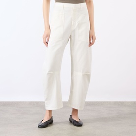 Model wearing Nili Lotan Vintage Cream wide-leg trousers with panelled knee detail, styled with black ballet flats.