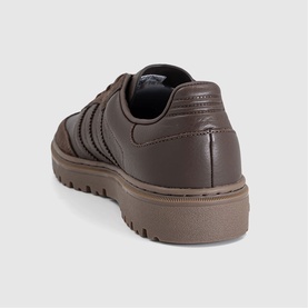 Dark brown leather low-top trainer, three stripe detail, matching brown chunky rubber sole, rear three-quarter view