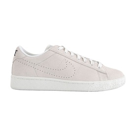 Nike trainer in sail white suede with perforated Swoosh detail, lace-up fastening, and white flatform sole with black heel tab.