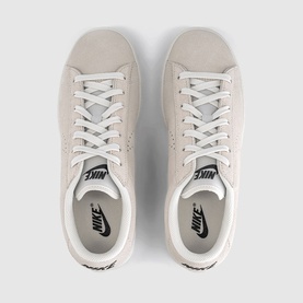 Nike low-top trainers in sail white suede, white laces, white cupsole, black Nike branding, overhead flat lay view