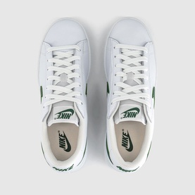 Nike trainers in white and Gorge Green, leather upper with green Swoosh branding, flat white sole, top-down view