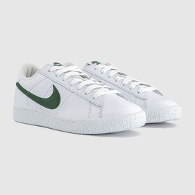 Nike white and Gorge Green leather low-top trainers with green Swoosh logo, white laces and flat white sole, three-quarter view