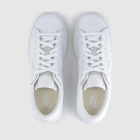 Nike white leather lace-up trainers, top-down view showing clean white sole and tonal laces
