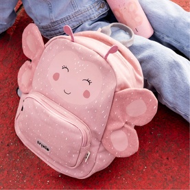 Trixie pink children's backpack with elephant face design, sparkle print, and 3D ears, styled with matching plush toy