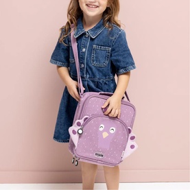 Model carrying Trixie purple owl-character lunch bag with crossbody strap, styled with denim dress