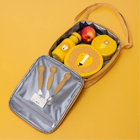 Trixie orange lion lunch bag open, showing matching lion-print containers, water bottle, wooden cutlery set and fresh apple on yellow background