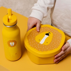 Trixie Lion Lunch Box in yellow with matching water bottle, held by child's hands on yellow surface