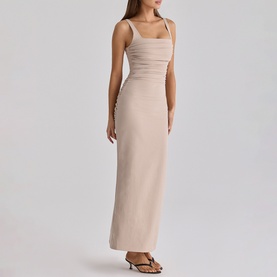 Model wearing House of CB taupe sleeveless maxi dress with square neckline, ruched waist detail, styled with brown sandals