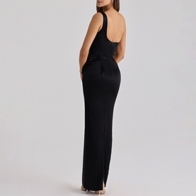 Model wearing black one-shoulder maxi dress with fitted silhouette, ruched bodice detail, and side split hem, shown from back