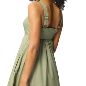 Model wearing Whistles green dress, back view showing adjustable straps and smocked waist detail with open back