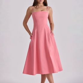 Model wearing House of CB raspberry midi dress with square neckline, spaghetti straps, A-line skirt and side pockets