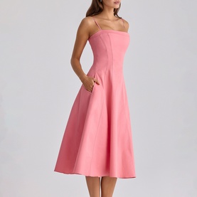 Model wearing House of CB raspberry midi dress with spaghetti straps, fitted bodice, full A-line skirt and side pocket detail