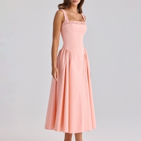 Model wearing House of CB peach midi dress with square neckline, embellished straps, pleated skirt and cut-out waist detail